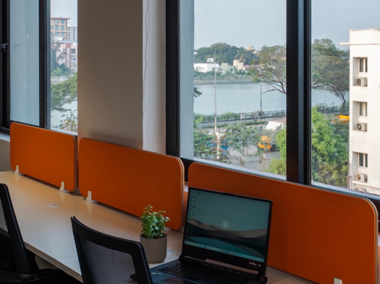 Window desks overlooking Valankulam lake from the 16 seater private office at Fliqzo
