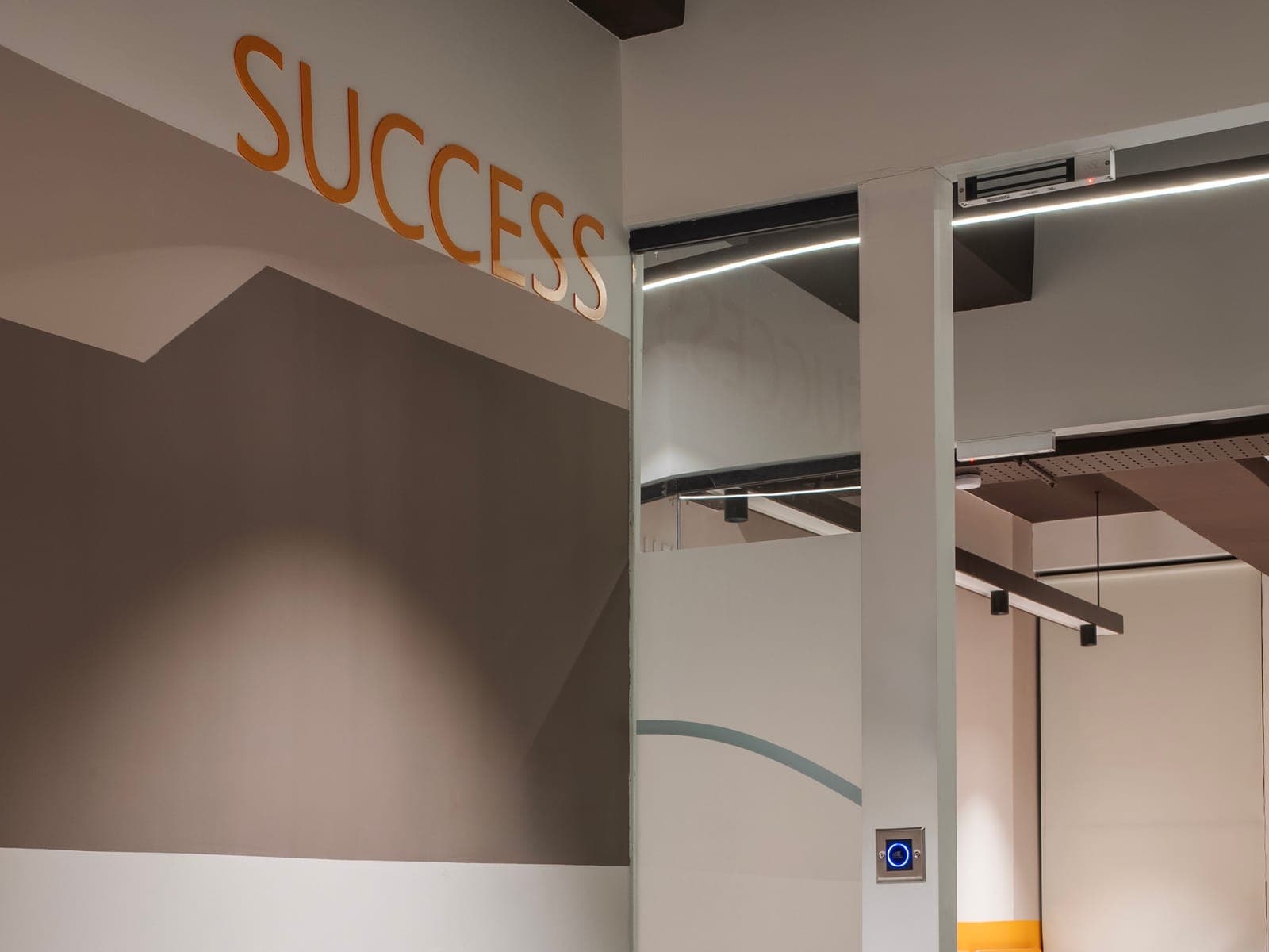 Success lettering beside the glass entrance of the 4 seater lake view private office at Fliqzo