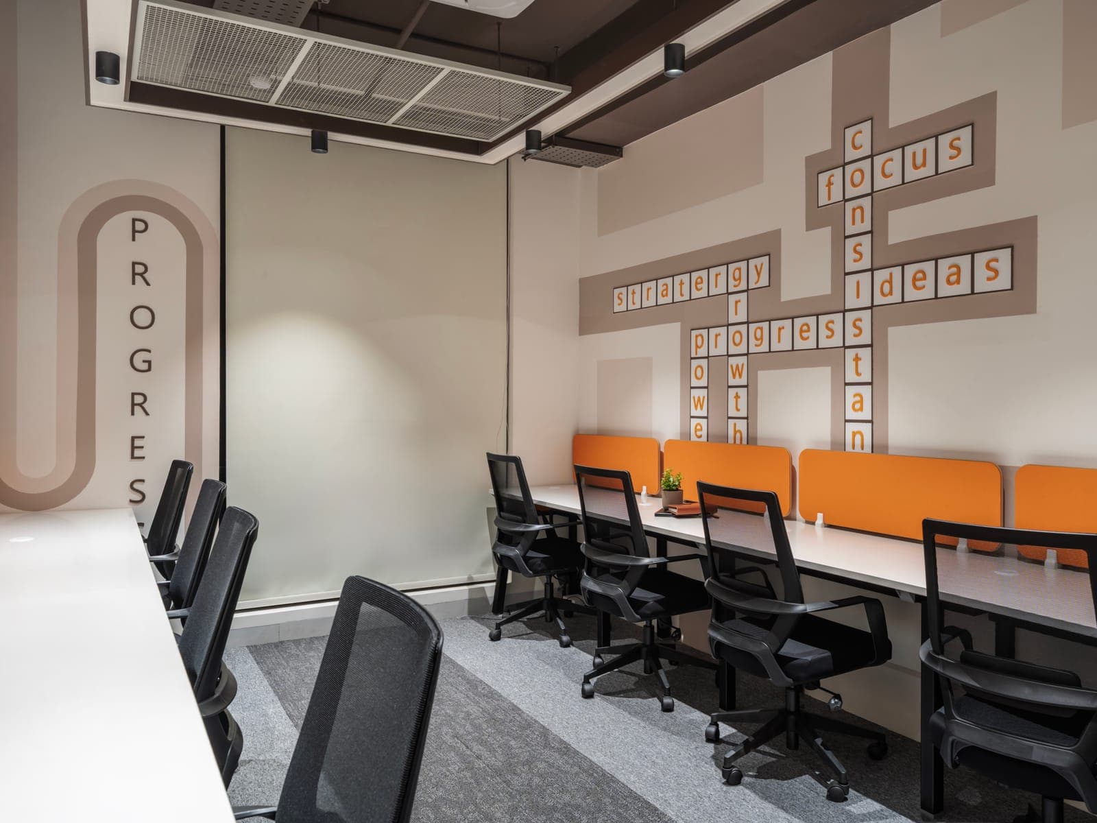 Crossword wall art with strategy, focus and ideas across the 8 seater private office at Fliqzo